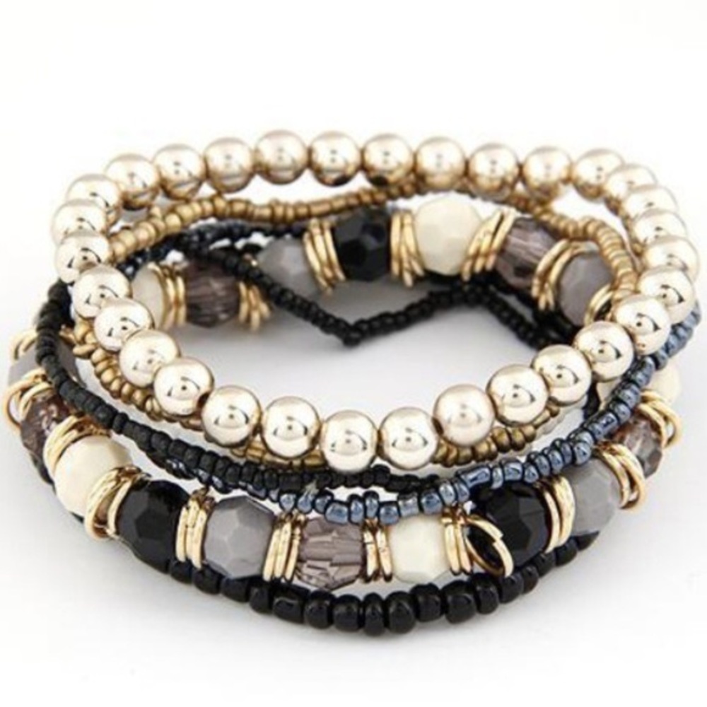 FINAL PRICE ⭐️ Seven stacked bracelets black gold.
